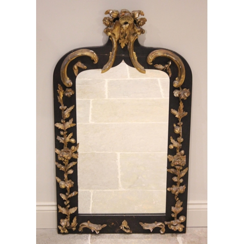 506 - A 19th century and later constructed ebonised wall mirror, of rectangular form with ogee shoulders, ... 