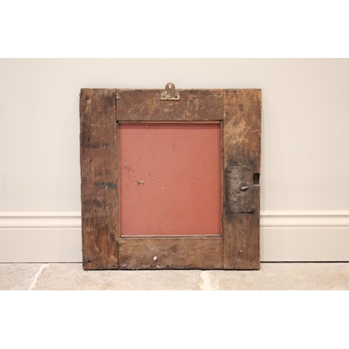 509 - A 17th century and later constructed carved oak mirror, the square frame carved with scrolling folia... 