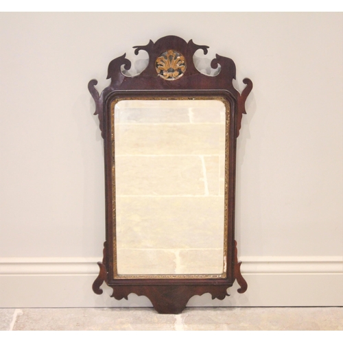 510 - A George III mahogany fretwork wall mirror, with a gilt openwork crest above the rectangular bevelle... 