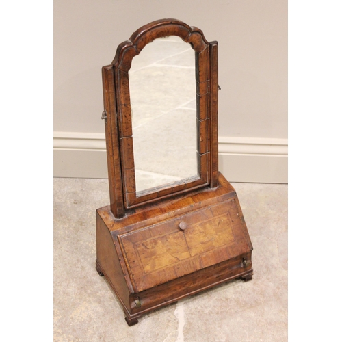 511 - A George I cross banded walnut dressing table mirror, the arched Dutch style swing mirror above a fa... 