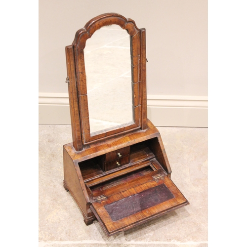 511 - A George I cross banded walnut dressing table mirror, the arched Dutch style swing mirror above a fa... 