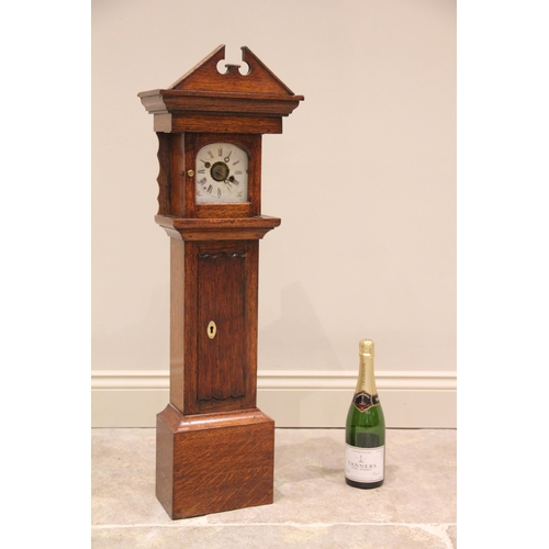 513 - * A miniature oak cased grandfather clock, early 20th century, with an architectural broken pediment... 