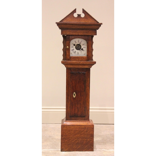 513 - * A miniature oak cased grandfather clock, early 20th century, with an architectural broken pediment... 