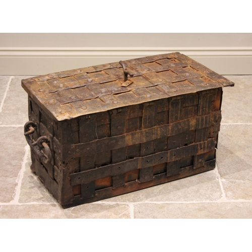 521 - A 17th century iron strapwork safe box (Corsair), probably German, Nuremberg, of strap and rivet con... 