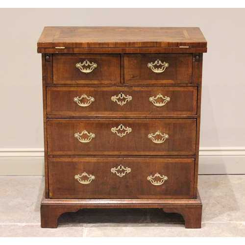 527 - A George II style walnut fold over bachelors chest, the crossbanded folding top above two short and ... 