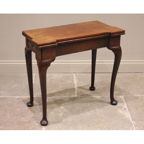 532 - A George II mahogany folding games/bridge table, the rectangular top with pronounced angular corners... 