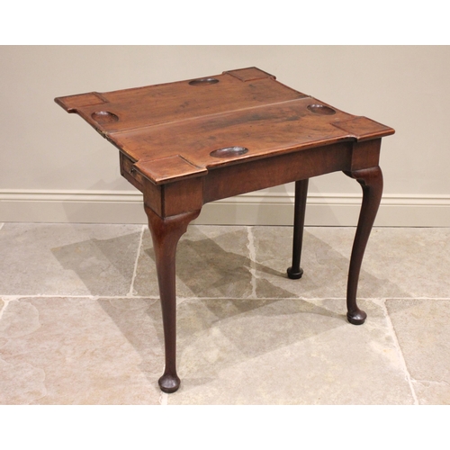 532 - A George II mahogany folding games/bridge table, the rectangular top with pronounced angular corners... 