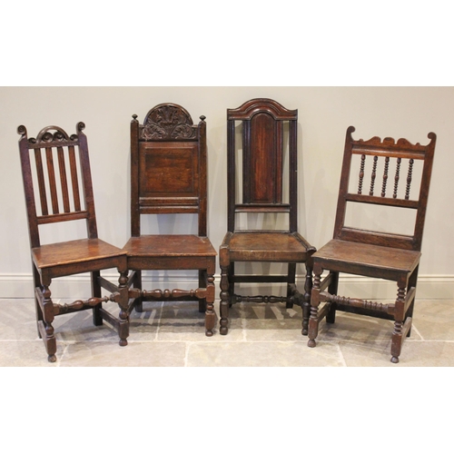 535 - Four assorted Charles II and later oak chairs, to include an arched panel back example with a board ... 