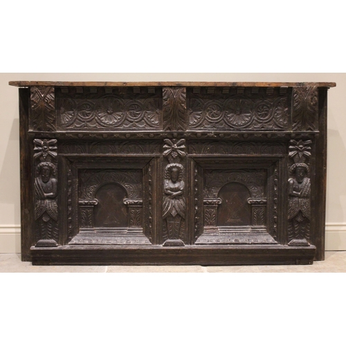 537 - An Elizabethan carved oak headboard, later converted to an overmantel, with carved roundel detail pu... 