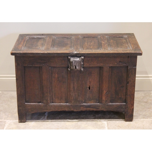 540 - A 17th century oak four panel coffer, the cover with four inverted panels above a conforming front p... 