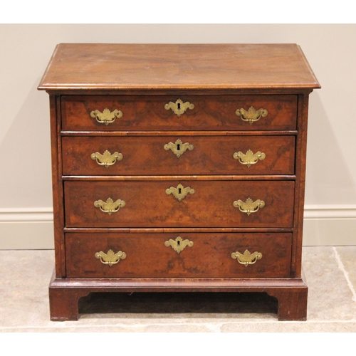 541 - An early 18th century and later, figured walnut bachelors chest, the rectangular quarter veneered an... 