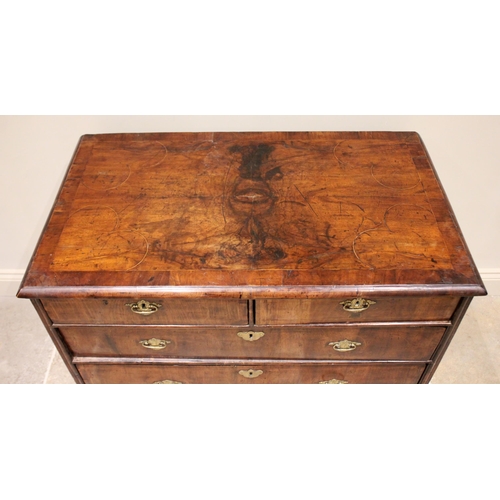 542 - A William and Mary figured walnut chest of drawers, the rectangular crossbanded top inlaid with cord... 