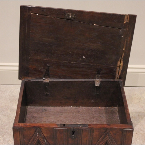 549 - A 17th/18th century oak table top cabinet. the hinged top opening to a vacant interior above a friez... 