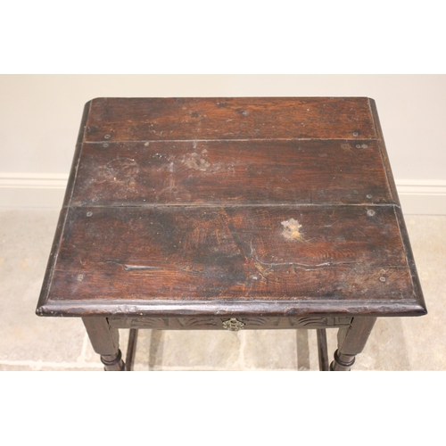 551 - A 17th century and later oak side table, the rectangular three board top above a single frieze drawe... 