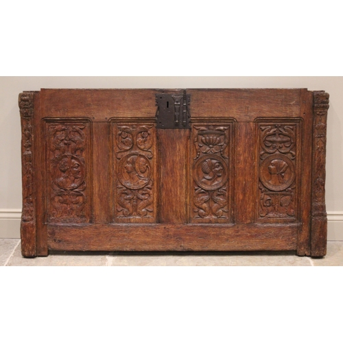 554 - A 16th/17th century oak coffer front panel, possibly French, applied with an iron lock plate above f... 