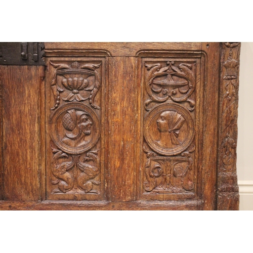 554 - A 16th/17th century oak coffer front panel, possibly French, applied with an iron lock plate above f... 