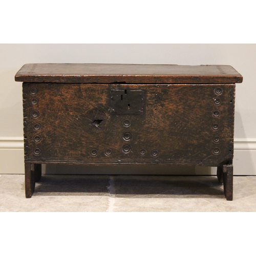 561 - A mid 17th century and later Welsh oak six plank coffer bach, the hinged top with a serrated edge an... 