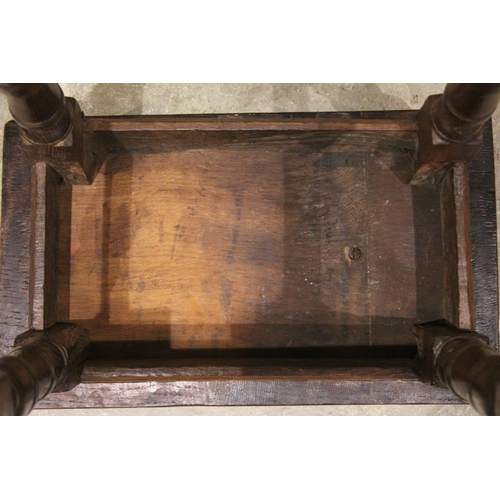 563 - An 18th century and later oak joint stool, the rectangular top with a moulded edge over a lunette ca... 