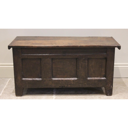 564 - A 17th century and later oak coffer bach, the associated twin board top, over three inverted panels,... 