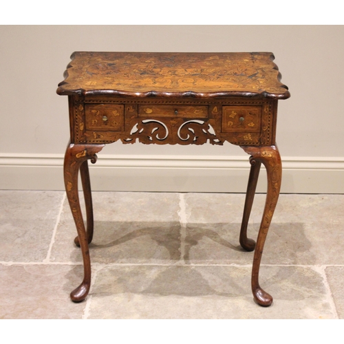 565 - An early to mid 18th century Dutch walnut and marquetry low boy, the shaped top inlaid with typical ... 