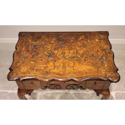 565 - An early to mid 18th century Dutch walnut and marquetry low boy, the shaped top inlaid with typical ... 