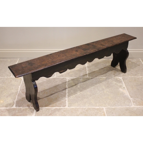 567 - A 17th century and later constructed oak bench or form, the rectangular top with a moulded edge over... 