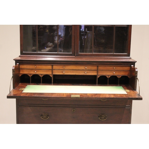 575 - * A George III mahogany secretaire bookcase, the moulded cornice above a pair of Gothic style astrag... 