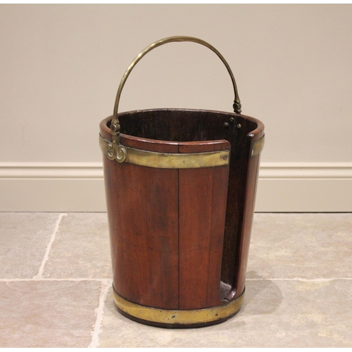 588 - A George III mahogany plate pail/bucket, of coopered form with a brass swing handle extending to scr... 