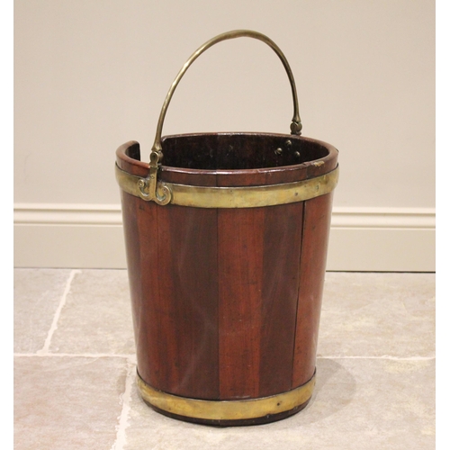 588 - A George III mahogany plate pail/bucket, of coopered form with a brass swing handle extending to scr... 