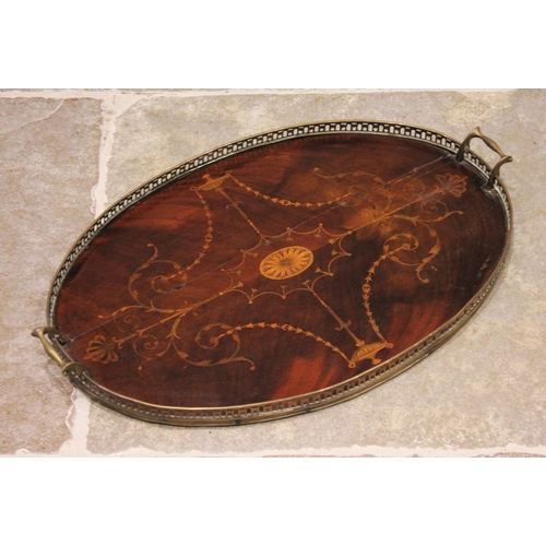 589 - A George III inlaid mahogany oval tray, with a pierced brass gallery and brass side handles, inlaid ... 