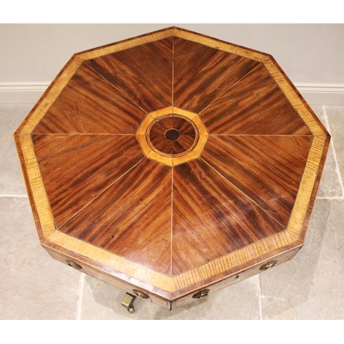 595 - A Regency mahogany and satinwood octagonal drum table, the segmentally veneered top with satinwood b... 