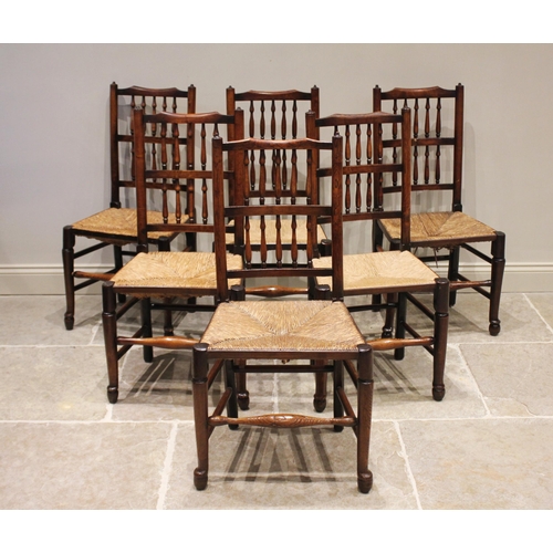 602 - * A harlequin set of eight ash, elm and alder Lancashire spindle back chairs, 19th century, each wit... 