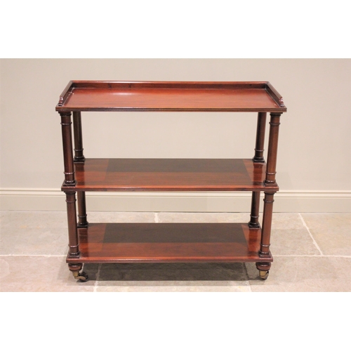 606 - * A 19th century mahogany dumb waiter, the rectangular three quarter galleried top tier, raised upon... 