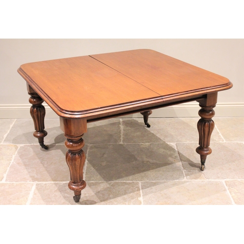 607 - * A Victorian mahogany extending dining table, the rectangular top with rounded corners and a moulde... 