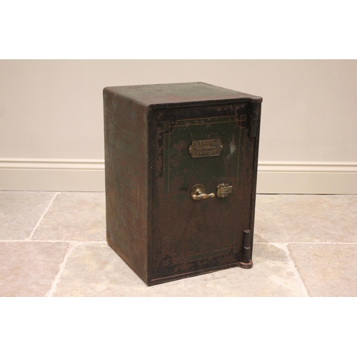 611A - * A late 19th/early 20th century iron freestanding safe by W E Brain, Birmingham, applied with a bra... 