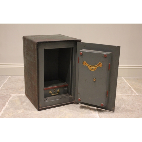 611A - * A late 19th/early 20th century iron freestanding safe by W E Brain, Birmingham, applied with a bra... 