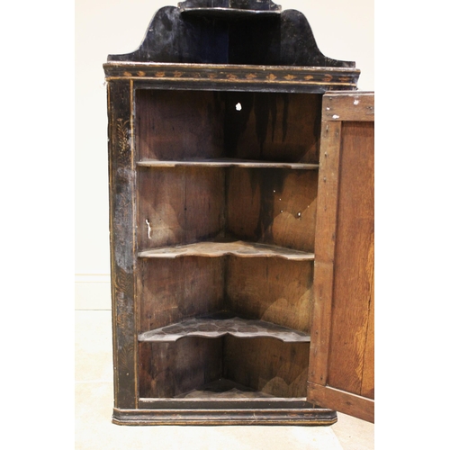 617 - A 19th century black lacquer chinoiserie hanging corner wall cupboard, the single straight front doo... 