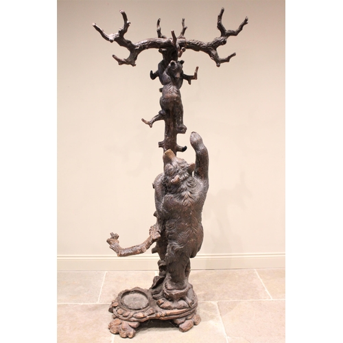 618 - A 19th century Black Forest figural oak hall stand, naturalistically carved as a cub bear hanging fr... 