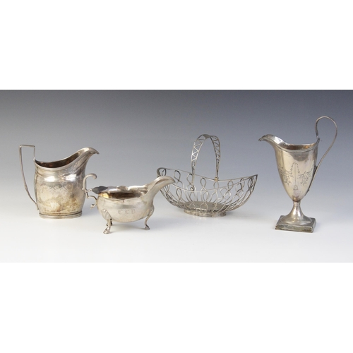 7 - A George III silver sauce boat, William Skeen, London 1764, of typical form with shaped rim and scro... 