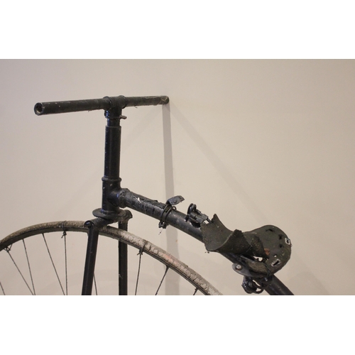 79 - A late 19th/early 20th century and later, Penny Farthing bicycle, the 122cm spoked wheel mounted wit... 