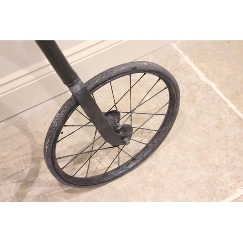 79 - A late 19th/early 20th century and later, Penny Farthing bicycle, the 122cm spoked wheel mounted wit... 