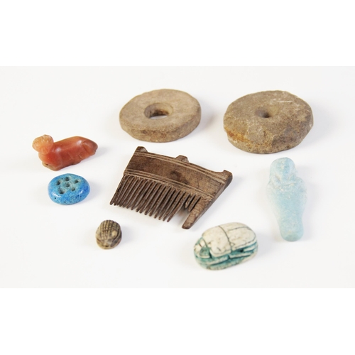 82 - * A small collection of ancient Egyptian and later antiquities, including a wooden hair comb, 52mm w... 