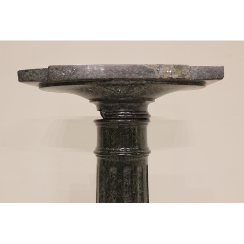 84 - * An Italian carved serpentine pedestal, 19th century, the fluted column below a square section plin... 