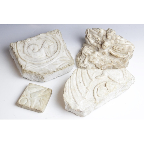 85 - A selection of carved architectural marble fragments, to include a relief carved example depicting a... 