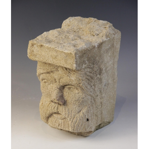 93 - A carved stone head, distinctively carved with a bearded gentleman in the medieval manner, 21.5cm hi... 