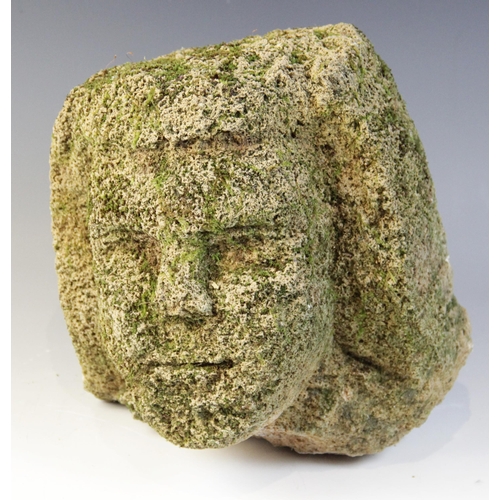 97 - A stone head in the medieval manner, 24.5cm high (at fault)