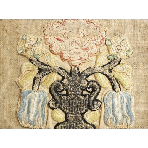 263 - An early 18th century embroidery fragment, the square panel depicting a hoopoe bird in a floral surr... 