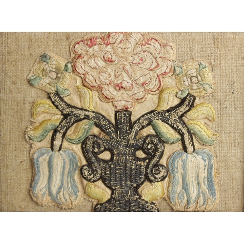 263 - An early 18th century embroidery fragment, the square panel depicting a hoopoe bird in a floral surr... 