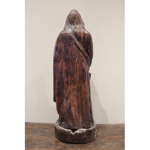 470 - An oak figural carving of St Peter, in the 15th century manner modelled standing, holding keys upon ... 