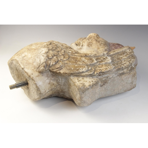 119 - A Roman marble fragmentary trapezophoros (table support) depicting the upper half of a griffin with ... 